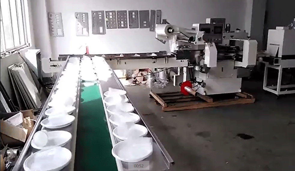 Disposable plate shrink wrapping machine